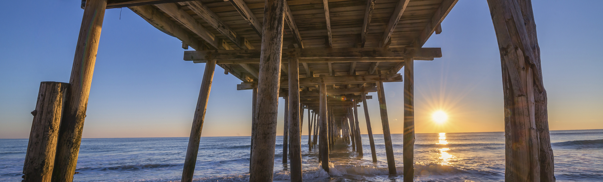 Sunrise from underneath Nags Head Pier 